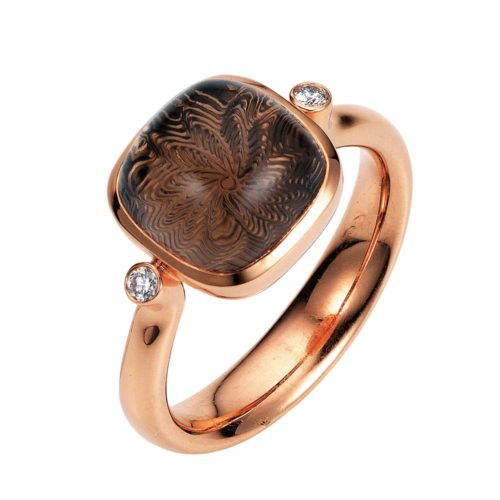 Gold ring with brown gemstone on guilloched surface and diamonds