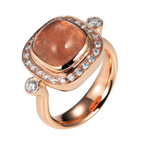 Gold ring with diamonds and peach coloured gemstone