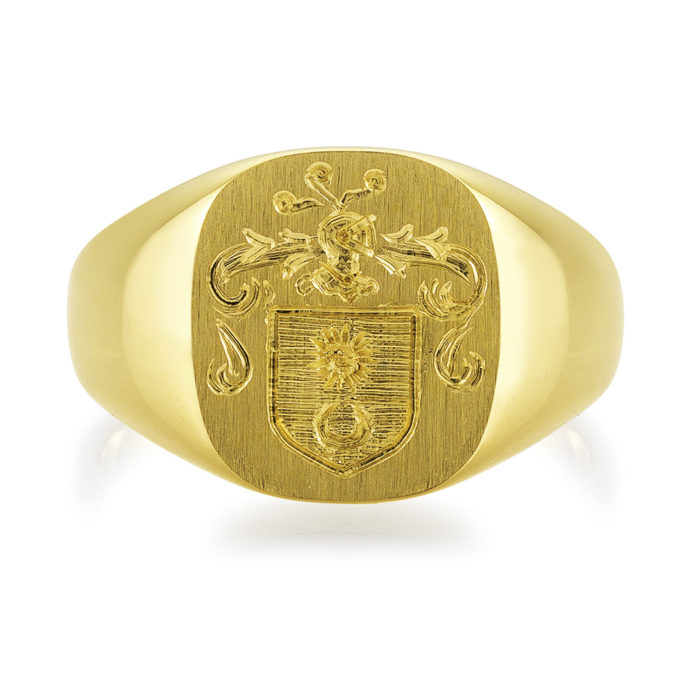 yellow-gold signet-ring with cushion shaped metal plate and an engraved coat of arms