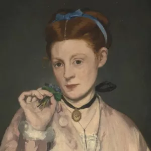Painting of a lady with red hair and blue ribbon dressed in a pink coat with a locket pendant on her neck attached with a black ribbon. The lady holds her right hand with a bunch of herbs next to her face. A grey parrot to ther left. Dark background.