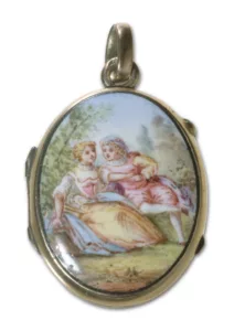 Oval locket penant with enamelled painting of man and woman positioned close to each other in a garden scene