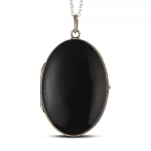 Oval black locket pendant attached to a fine silver chain.