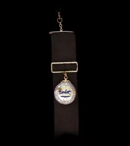 Black watch fob and round golden locket pendant with enamel and diamonds