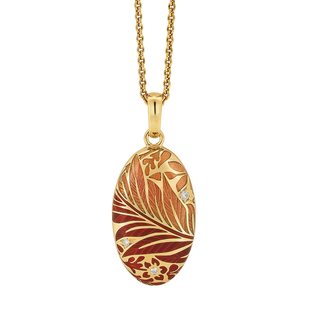 Ovaler Anhänger aus Gelbgold mit roter Farbe und Brillanten.