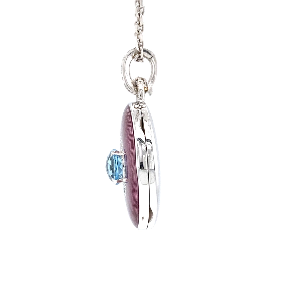 Oval pendant in white gold, with pink colour, decorated with diamonds and a blue gemstone