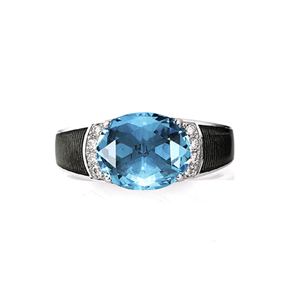 Ring aus Weißgold mit grauer Farbe verziert mit Brillanten und einem blauen Edelstein