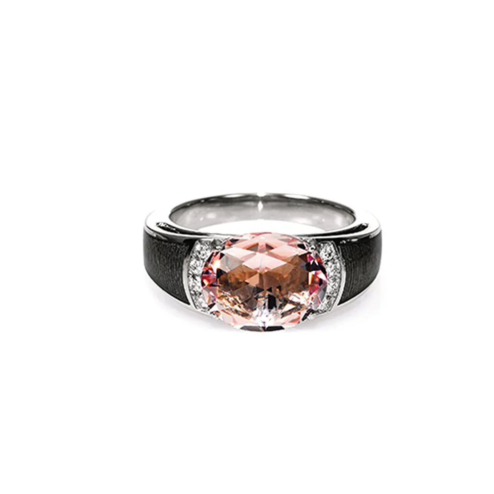Ring white gold decorated with grey colour, with oval purple gemstone and diamonds.