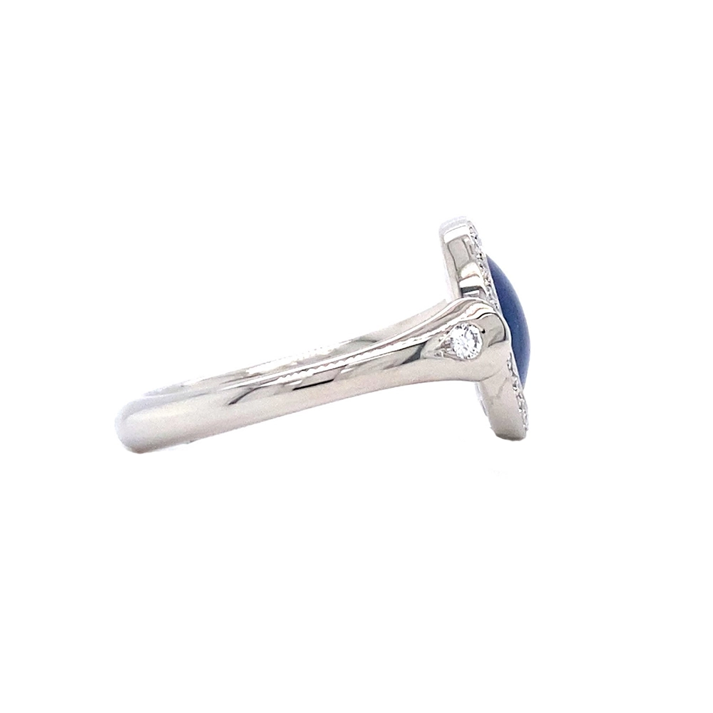Ring Candy in white gold with a round 12.2 mm head featuring slightly domed petrol blue enamel over a windmill guilloché pattern, surrounded by 22 diamonds.