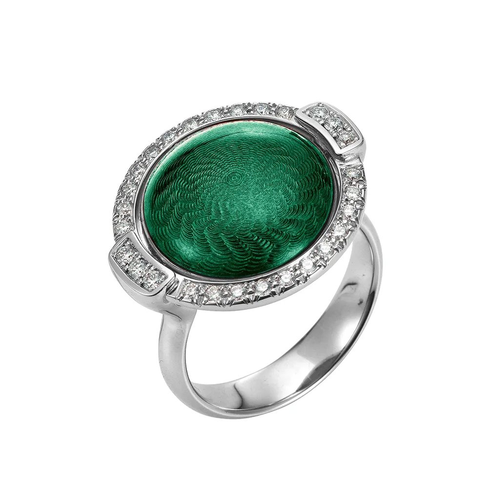 Swivel ring Candy in white gold with a round domed centre lens that can be turned to show emerald green or aubergine enamel, decorated with a windmill guilloché pattern and framed with 28 diamonds, 20 x 22 mm.