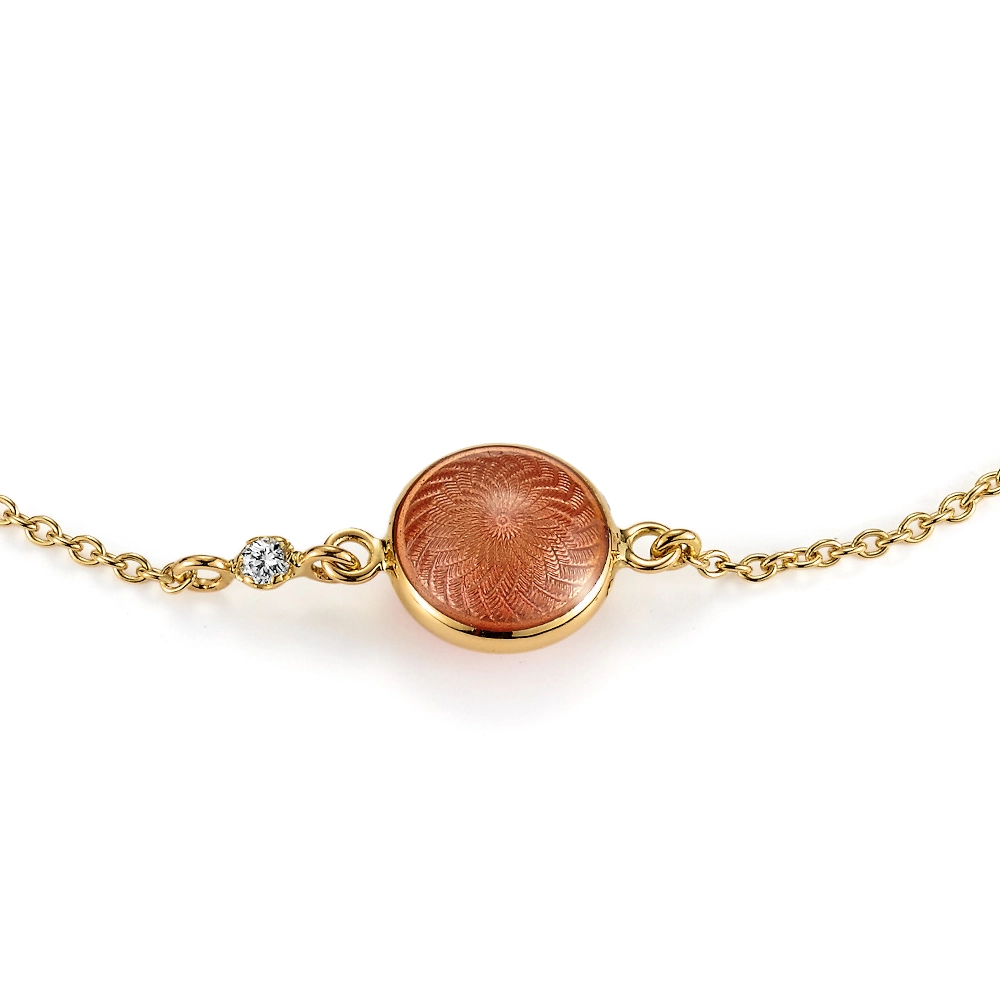 Candy bracelet in yellow gold featuring a double-sided, round, slightly domed central enamel element in translucent pink vitreous enamel over fine windmill guilloché, a sparkling diamond set into the anchor chain, and a guilloché hexagonal tag at the clasp, diameter 20.2 mm, length 19 cm.
