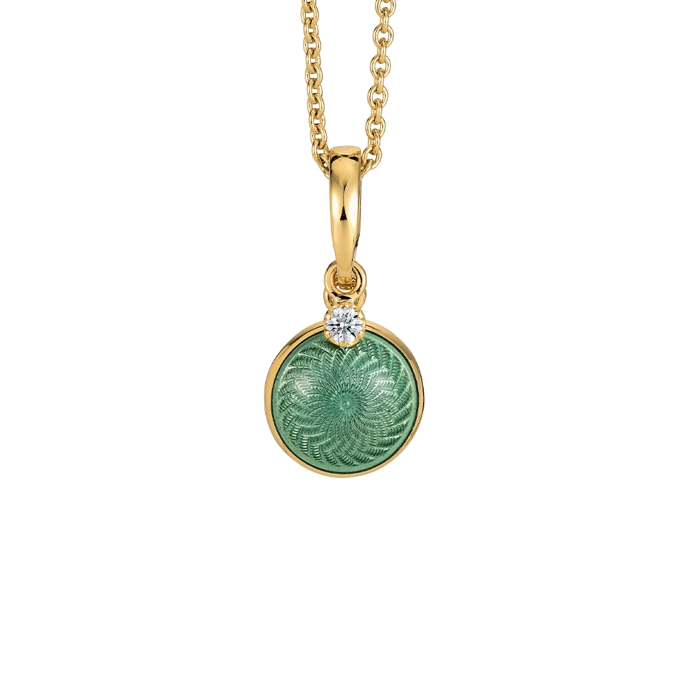 Round, slightly domed Candy pendant in yellow gold with light turquoise enamel over windmill guilloché and a freely suspended diamond, diameter 10 mm.