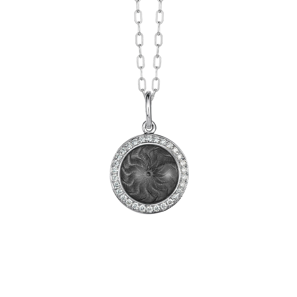 Trance pendant in 18k white gold with concave translucent tahitian-grey enamel, windmill guilloché and 30 brilliant-cut diamonds 0.15 ct, diameter 12.5 mm, limited to 500 pieces.