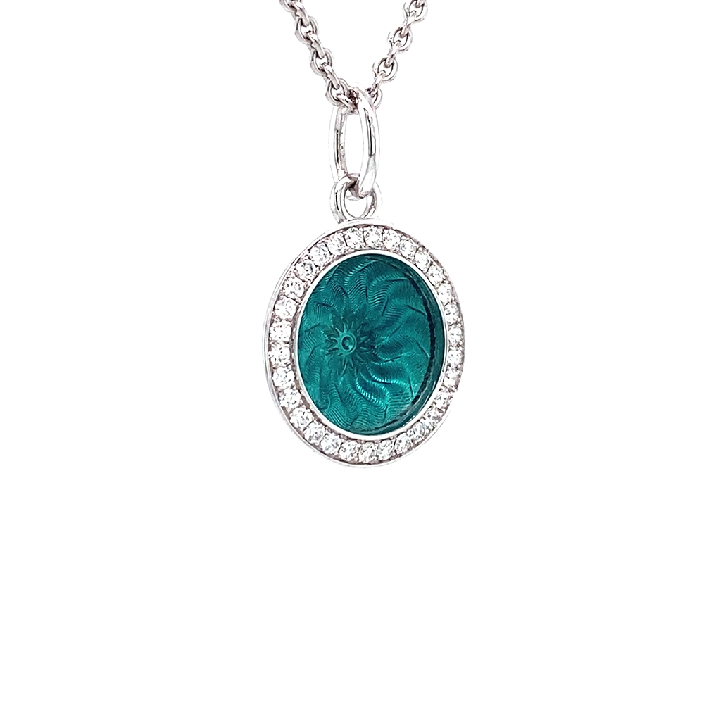 Trance pendant in 18k white gold with concave translucent turquoise enamel, windmill guilloché and 30 brilliant-cut diamonds 0.15 ct, diameter 12.5 mm, limited to 500 pieces.