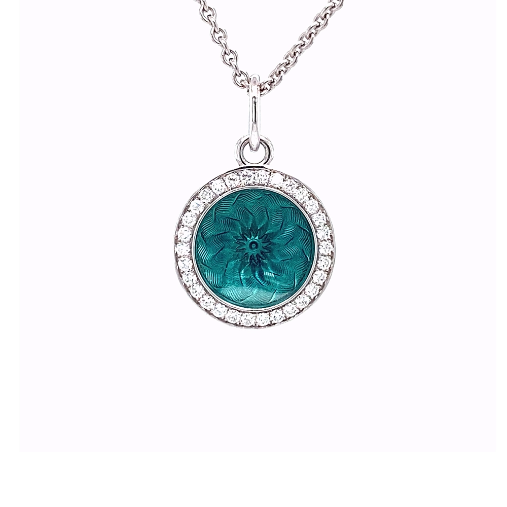 Trance pendant in 18k white gold with concave translucent turquoise enamel, windmill guilloché and 30 brilliant-cut diamonds 0.15 ct, diameter 12.5 mm, limited to 500 pieces.