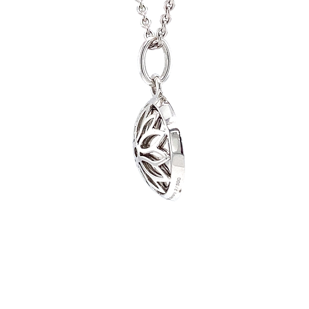 Trance pendant in 18k white gold with concave translucent turquoise enamel, windmill guilloché and 30 brilliant-cut diamonds 0.15 ct, diameter 12.5 mm, limited to 500 pieces.