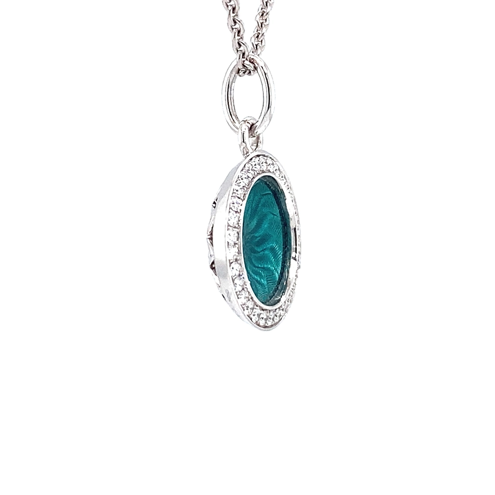 Trance pendant in 18k white gold with concave translucent turquoise enamel, windmill guilloché and 30 brilliant-cut diamonds 0.15 ct, diameter 12.5 mm, limited to 500 pieces.