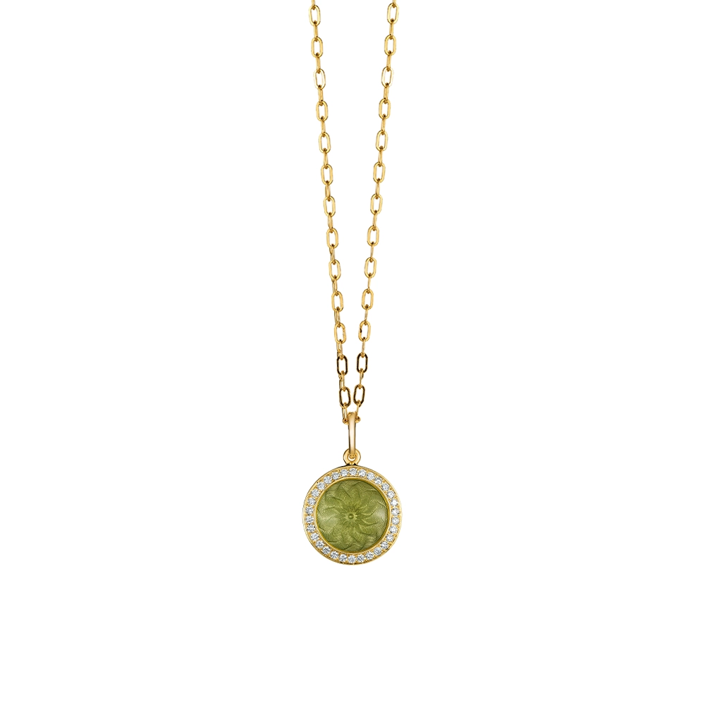 Trance pendant in 18k yellow gold with concave translucent pastel-green enamel, windmill guilloché and 30 brilliant-cut diamonds 0.15 ct, diameter 12.5 mm, limited to 500 pieces.