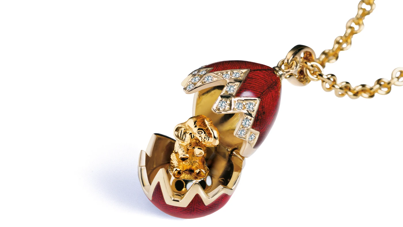 Fabergé Locket Pendant with Ruby Red Enamel and Elephant Surprise Fabergé locket pendant with ruby red enamel opening to reveal an elephant miniature, set with diamonds.