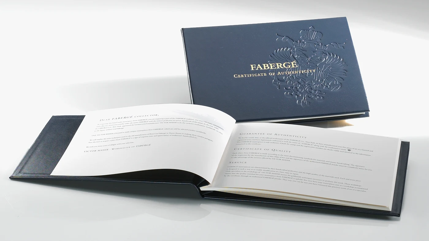 Fabergé Certificate for Victor Mayer Object of Art Leather-bound Fabergé certificate for an object of art by Victor Mayer, shown closed and opened.