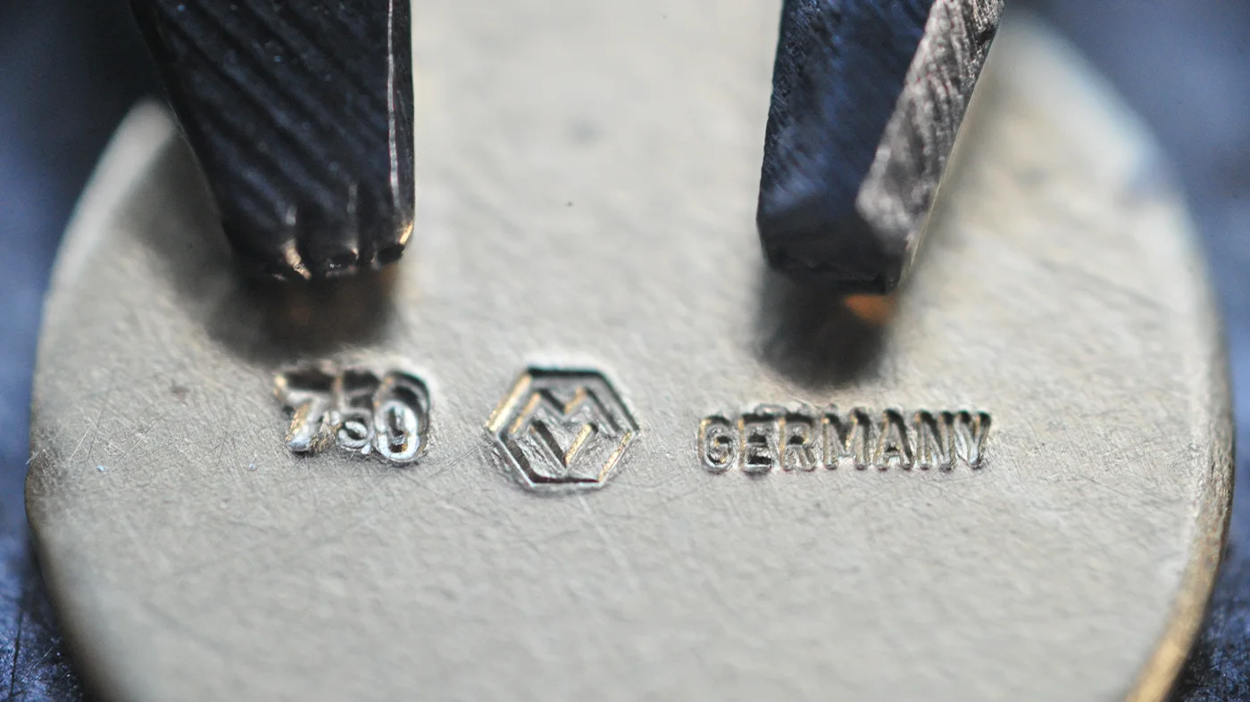 Victor Mayer Jewellery Hallmarks and Hallmark Punch Tool Victor Mayer jewellery hallmarks showing 750 for 18 carat gold, MV hexagon maker’s mark, Germany country mark, and a hallmark punch tool.