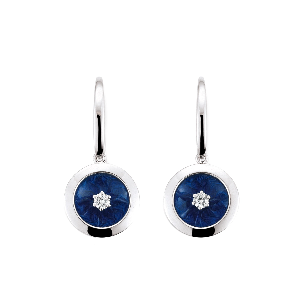 Ear hooks in white gold. From each hook hangs a round element with a concave surface covered in Electric Blue vitreous enamel, showing a windmill guilloché pattern beneath. A single small diamond is set at the centre of each enamel surface. Diameter of the round element approximately 12.5 mm.