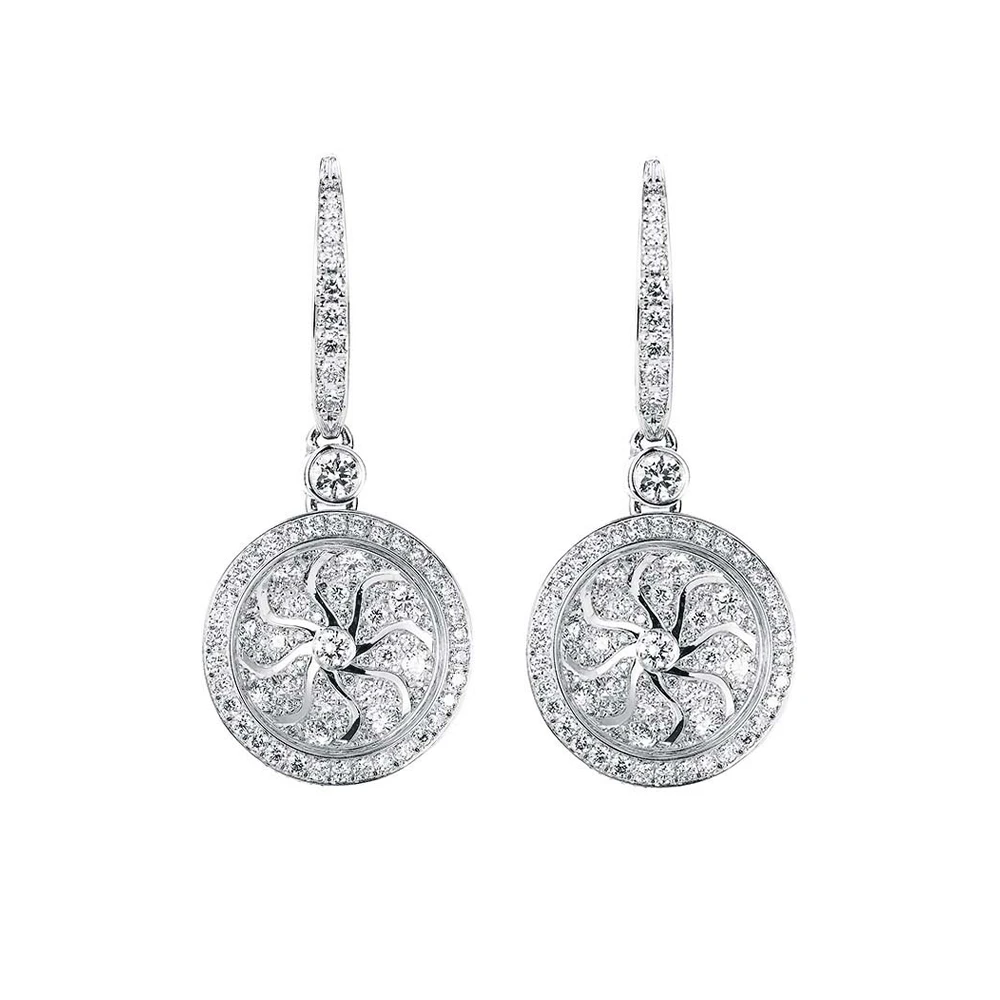 Trance ear hooks in white gold with a round, concave element executed as Guilloché-Pavée in windmill pattern, set entirely with diamonds, diameter 14.1 mm.