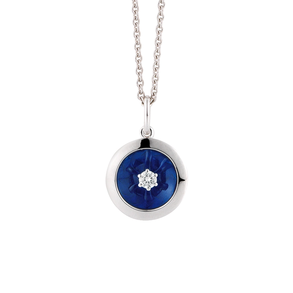 Round Trance pendant in white gold with concave electric blue enamel over windmill guilloché and a single diamond, diameter 12.5 mm.