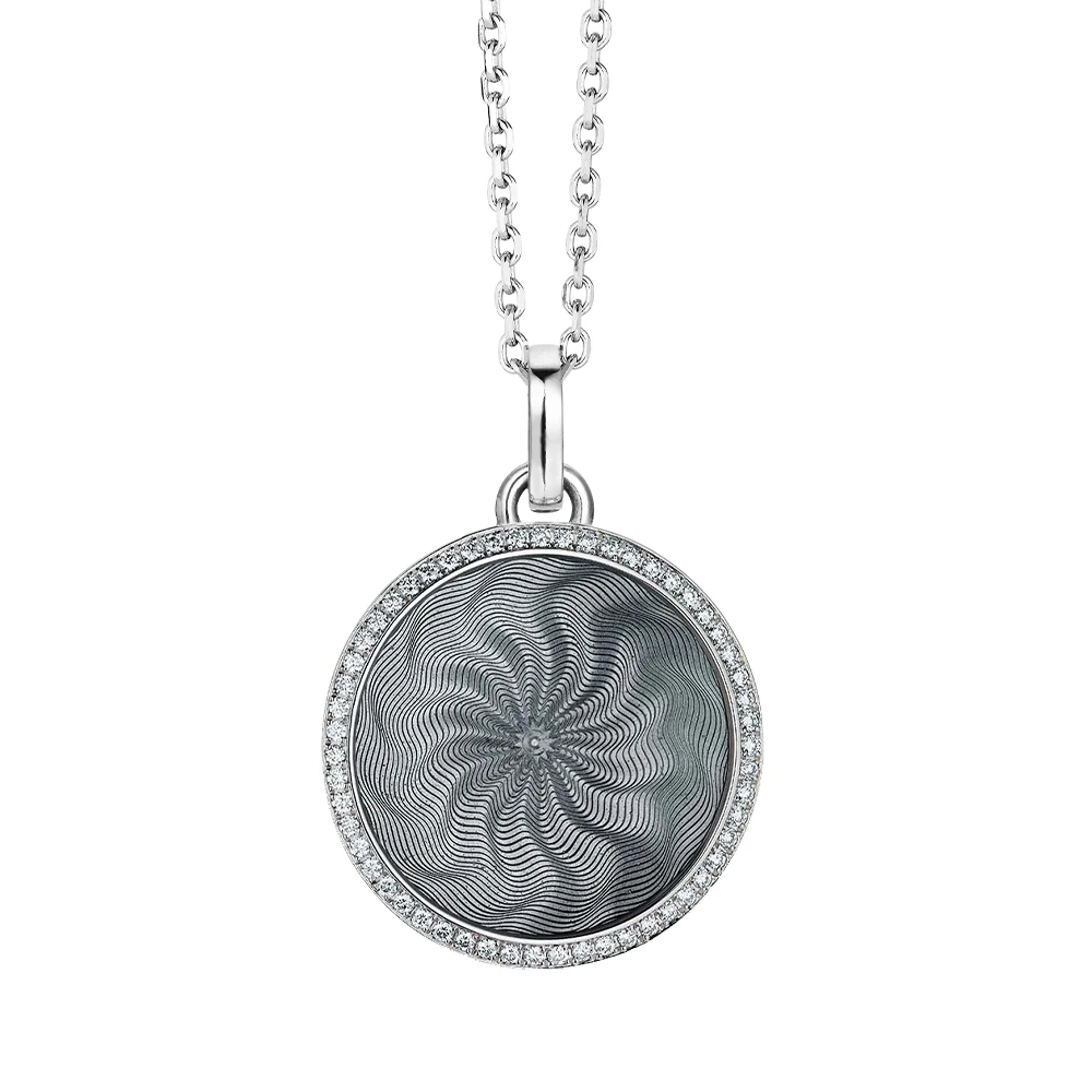Trance pendant in 18k white gold with concave translucent tahiti-grey enamel, windmill guilloché and 55 brilliant-cut diamonds 0.33 ct, diameter 24,2 mm, limited to 300 pieces.