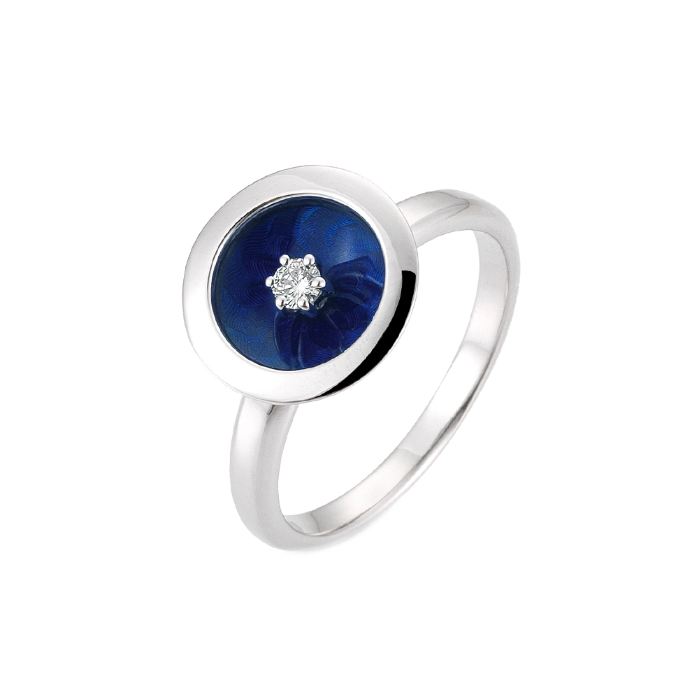 Ring in white gold with a round ring head. The ring head is concave and covered with translucent electric blue vitreous enamel, beneath which a fine windmill guilloché pattern is visible. A single small diamond is set at the centre of the enamel surface as a subtle focal point. The design appears calm, geometric, and balanced.
