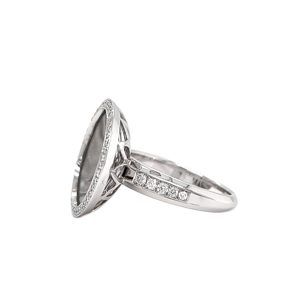 Trance ring in white gold with yellow gold base, concave translucent opalescent turquoise enamel over windmill guilloché and a surrounding diamond circle, diameter 18.4 mm.