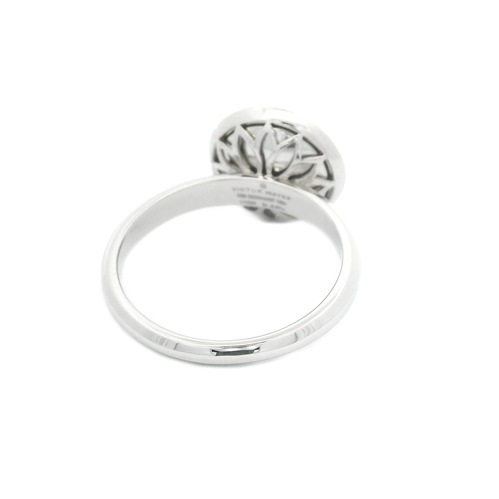 Ring in white gold with a round ring head. The ring head is concave and covered with translucent tahiti-grey vitreous enamel, beneath which a fine windmill guilloché pattern is visible. A single small diamond is set at the centre of the enamel surface as a subtle focal point. The design appears calm, geometric, and balanced.