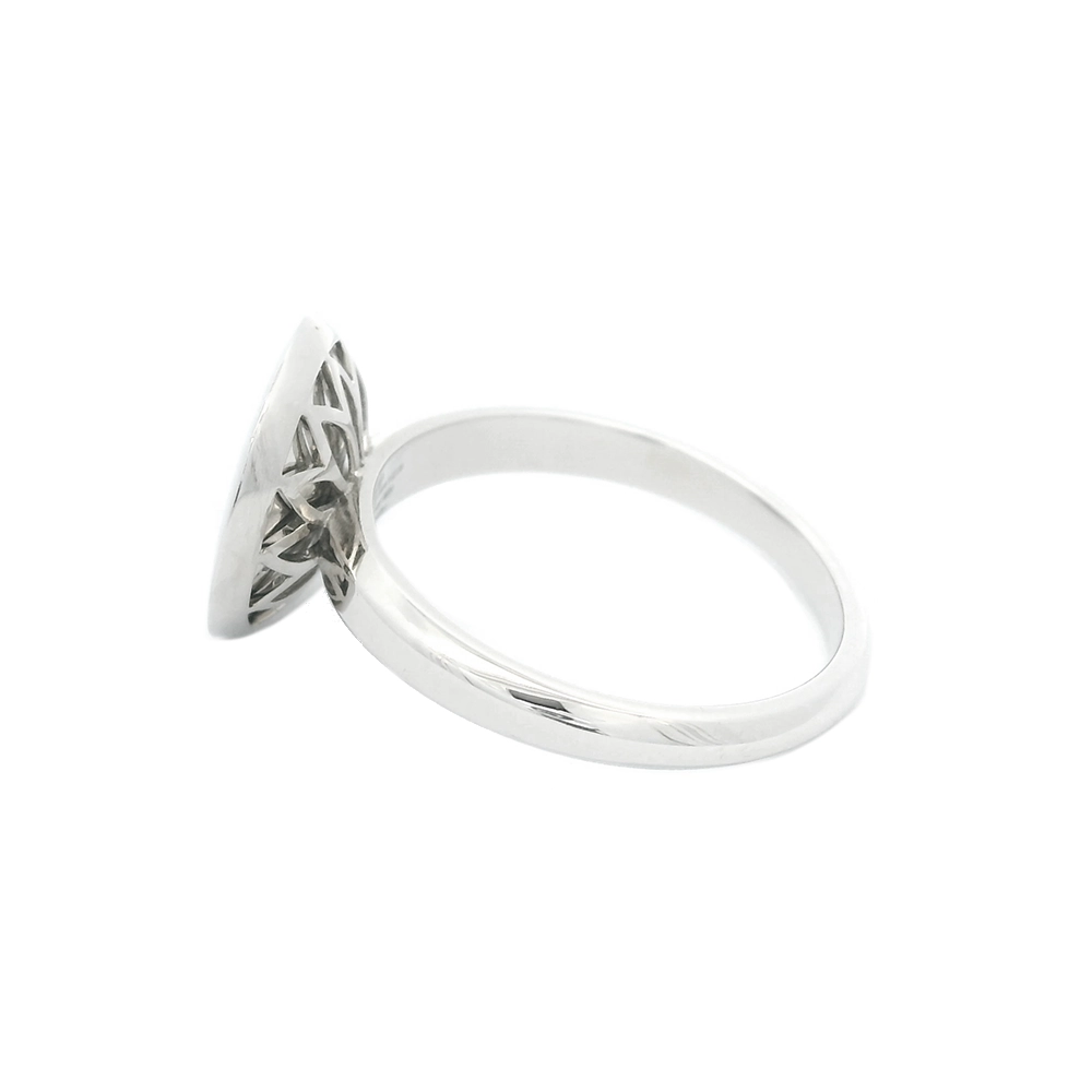 Ring in white gold with a round ring head. The ring head is concave and covered with translucent tahiti-grey vitreous enamel, beneath which a fine windmill guilloché pattern is visible. A single small diamond is set at the centre of the enamel surface as a subtle focal point. The design appears calm, geometric, and balanced.