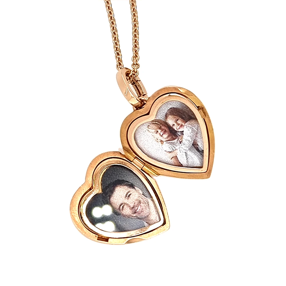 Heart shaped locket necklace in rose gold, decorated with diamonds