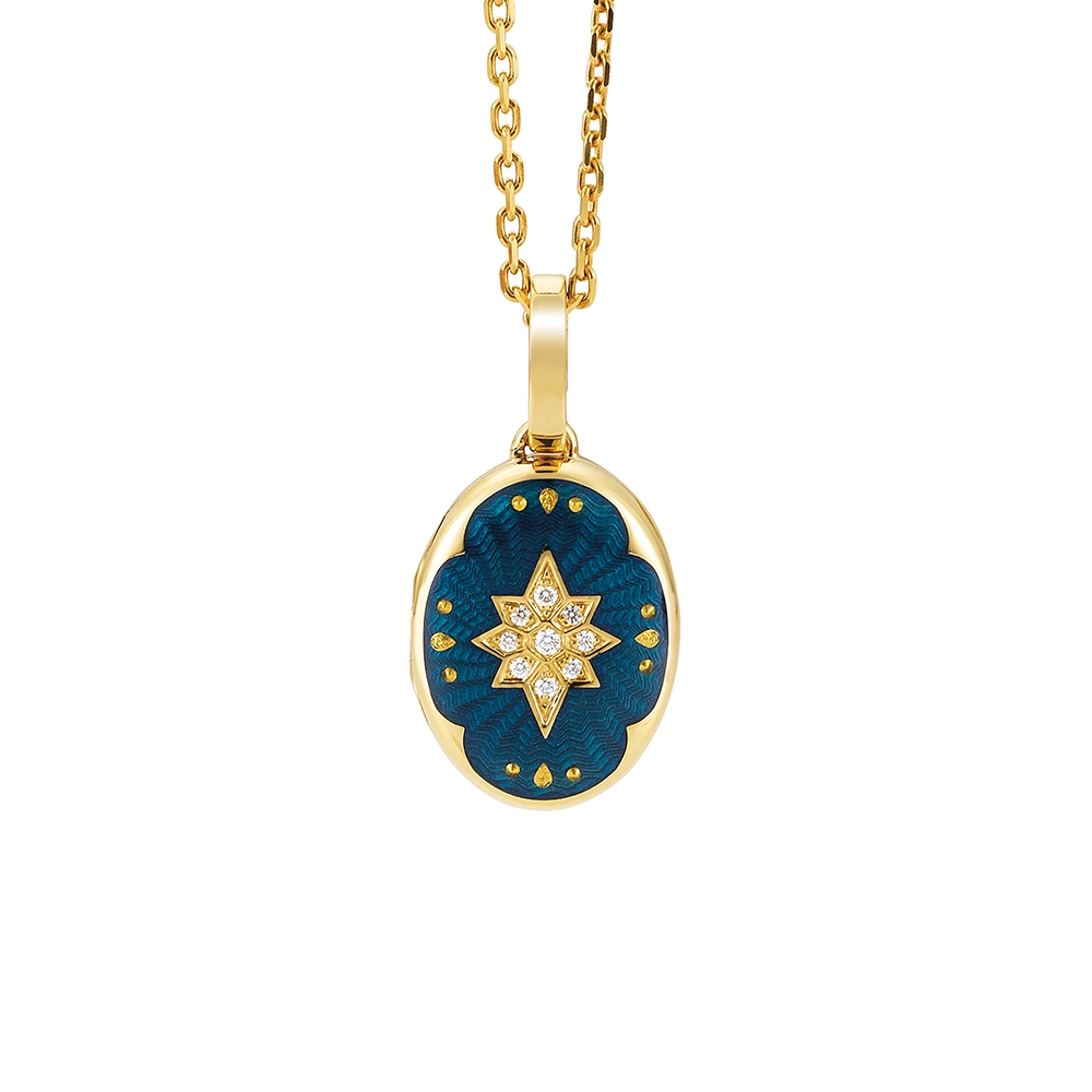 Ovaler Medaillon-Anhänger aus Gelbgold, blau lackiert mit einer vielzahl kleiner goldener Punkte und mit einem Stern aus Brillanten in der Mitte.