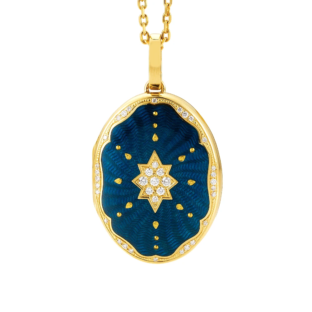 Ovaler Medaillon-Anhänger aus Gelbgold, blau lackiert mit einer vielzahl kleiner goldener Punkte und mit einem Stern aus Brillanten in der Mitte.