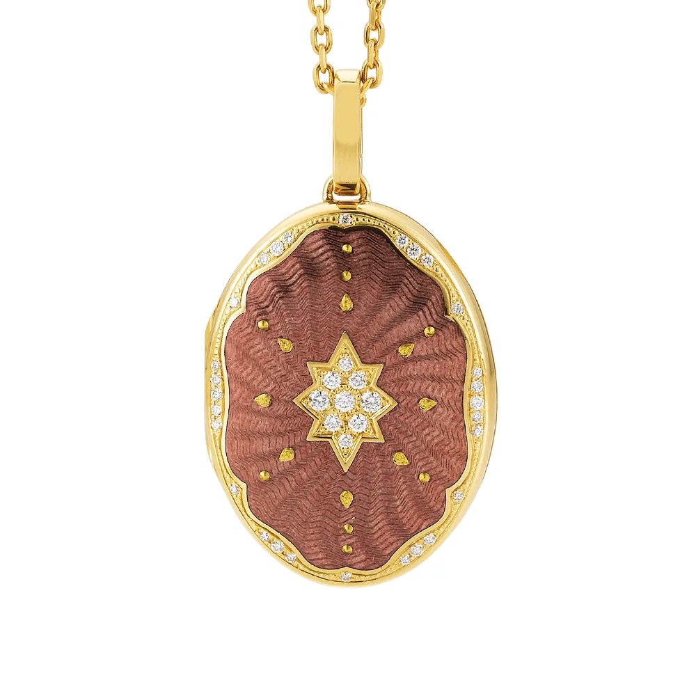 Ovaler Medaillon-Anhänger aus Gelbgold, lila lackiert mit einer vielzahl kleiner goldener Punkte und mit einem Stern aus Brillanten in der Mitte.