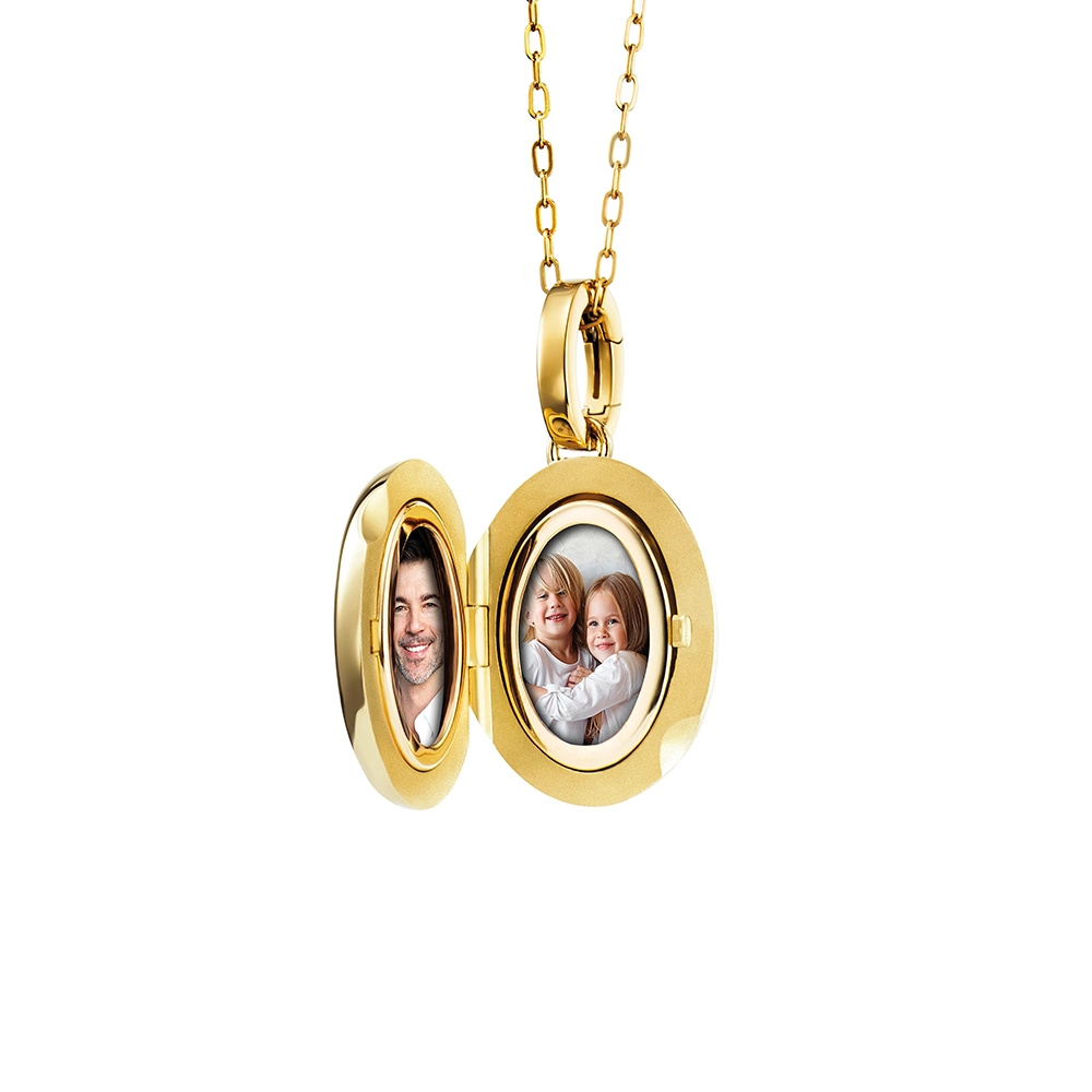 Oval locket pendant in yellow gold, lacquered light red with a multitude of small golden dots and a star made of diamonds in the centre,