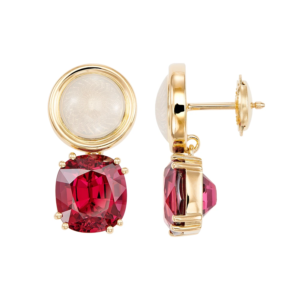 Pair of yellow-gold earrings with red cushion-cut rhodolites in four-claw settings and round white enamel boutons with gold rims.